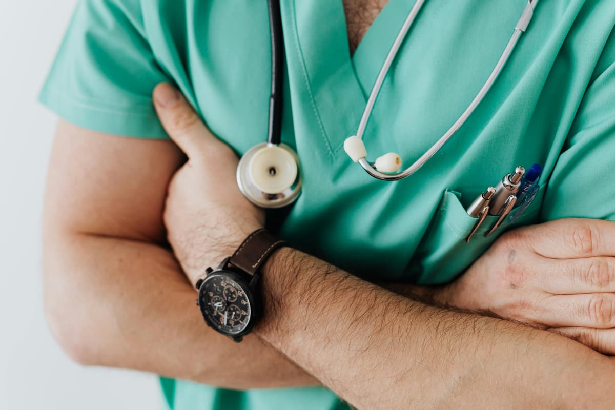 Medical professional helping a patient